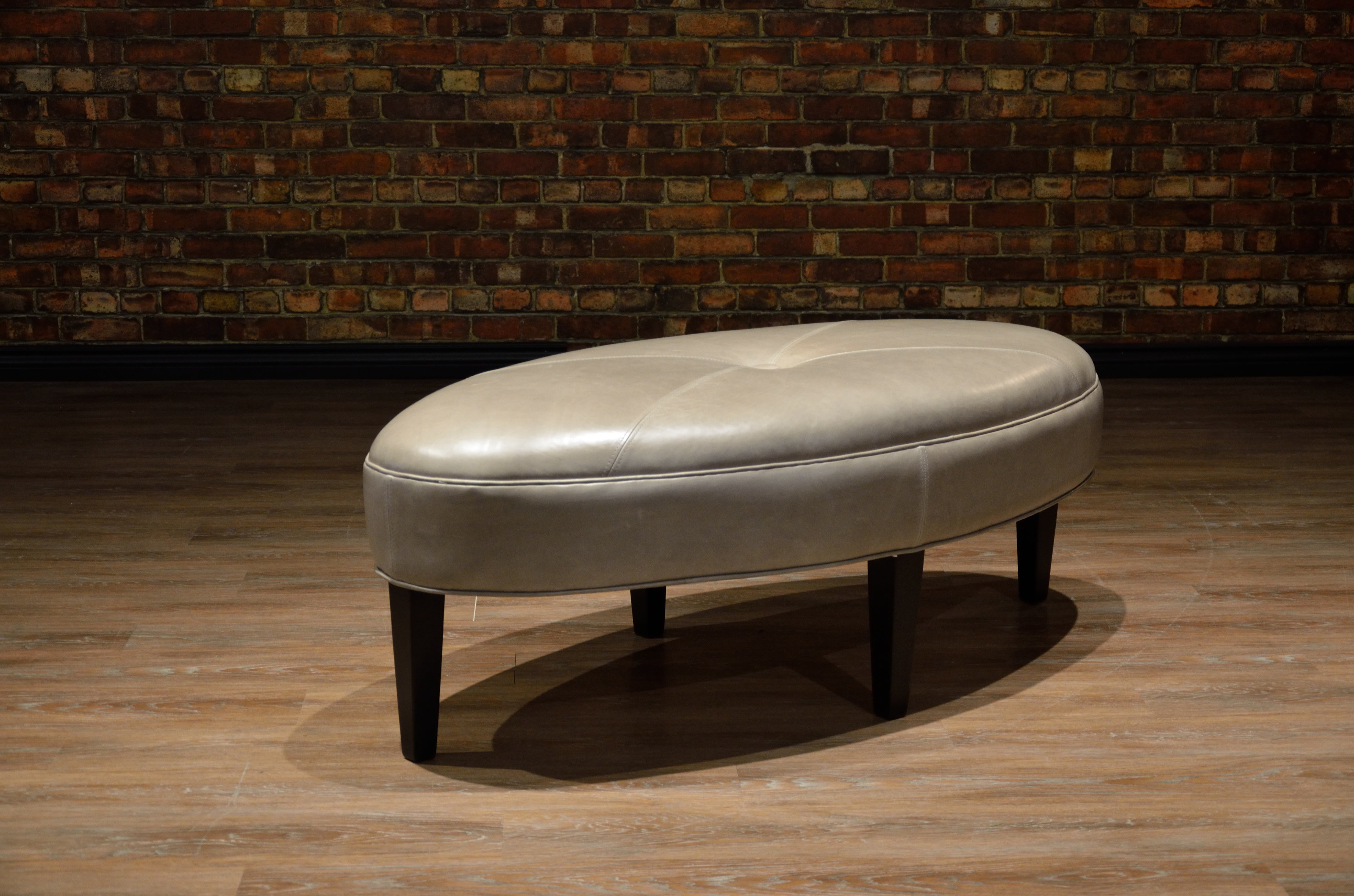 VIOLET OVAL LEATHER OTTOMAN